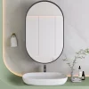 ProximaX Armoire à miroir ovale noire avec cadre métal, meuble mural avec étagères réglables, rangement salle de bain